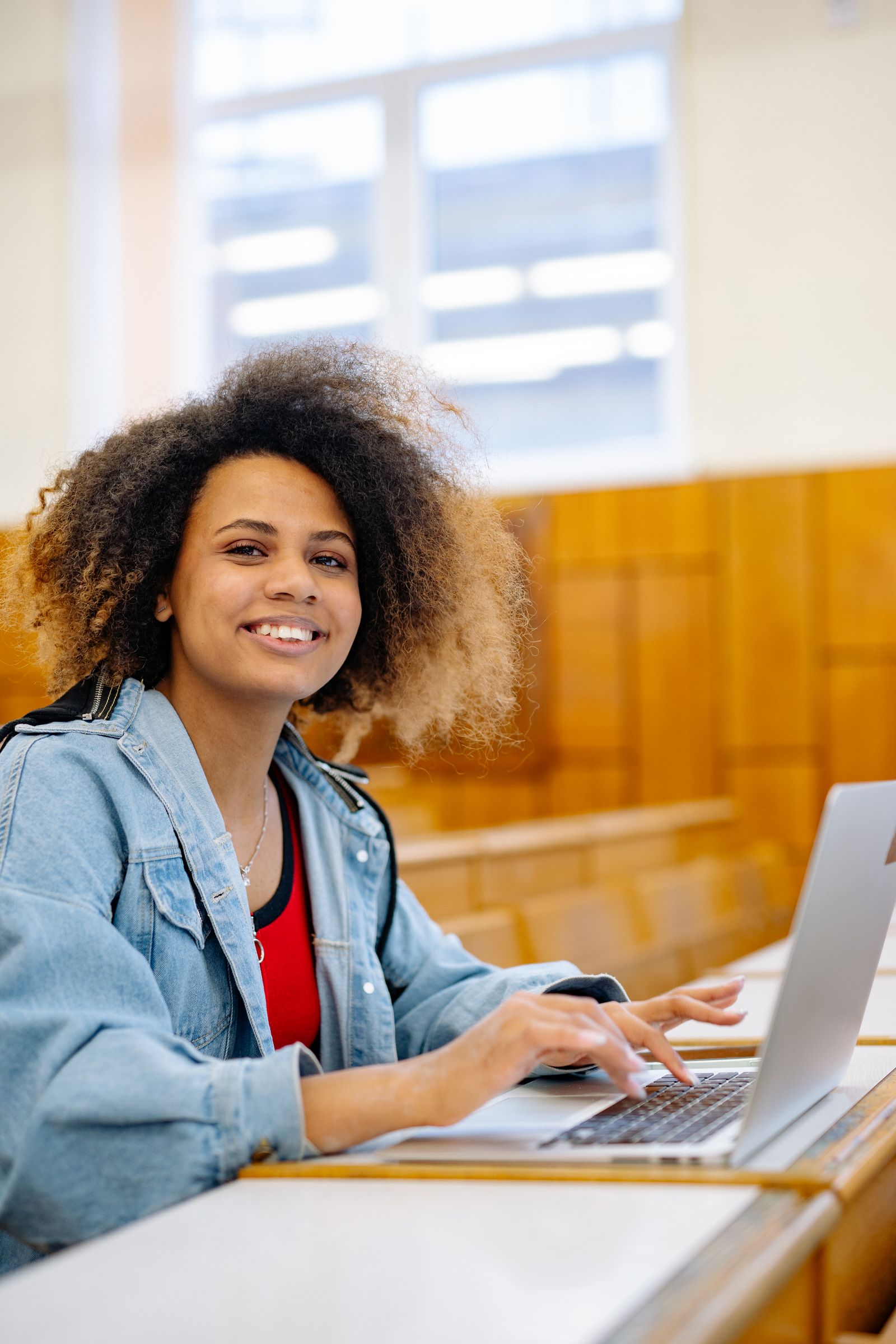 An IUniversity student studying on a laptop at home